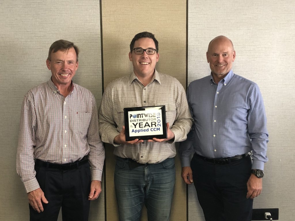 Martin Leahy (middle) received the Distributor of the Year award from John Steinbrenner (left) and Rick Matus (right)